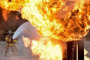 Fireman putting out fire