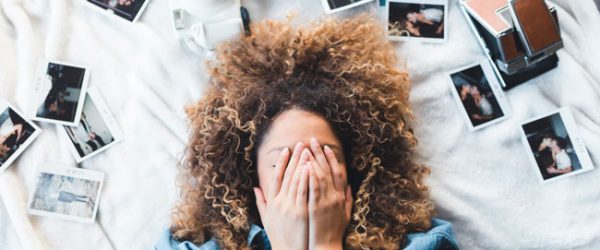 Picture of photos surrounding a woman