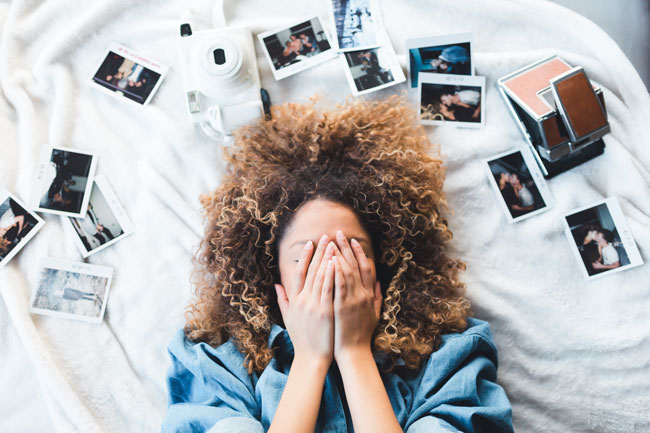 Picture of photos surrounding a woman